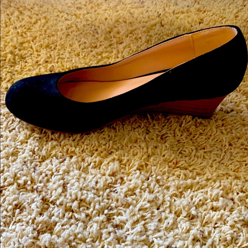 Black suede wedge with wooden heel.